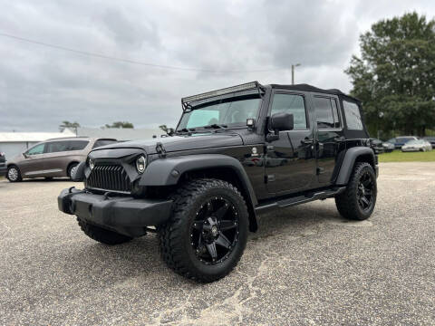 2015 Jeep Wrangler Unlimited for sale at Carworx LLC in Dunn NC