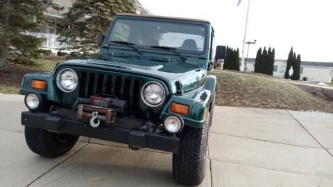 1999 Jeep Wrangler for sale at Heartbeat Used Cars & Trucks in Harrison Township MI