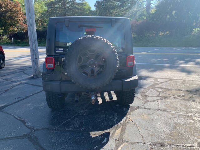 2014 Jeep Wrangler for sale at Chuckie Bizzarro's Fleetwing Auto in Erie, PA