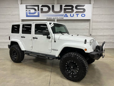2012 Jeep Wrangler Unlimited for sale at DUBS AUTO LLC in Clearfield UT