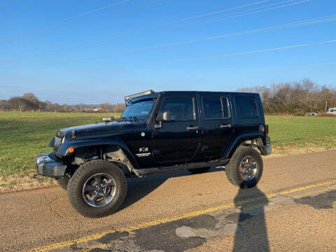 2009 Jeep Wrangler Unlimited for sale at Tennessee Valley Wholesale Autos LLC in Huntsville AL