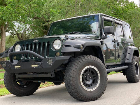 2011 Jeep Wrangler Unlimited for sale at HIGH PERFORMANCE MOTORS in Hollywood FL