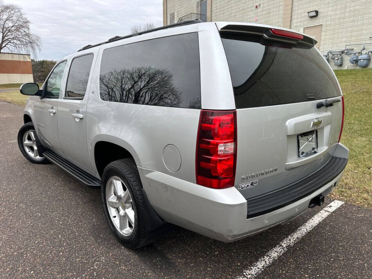 2011 Chevrolet Suburban for sale at JUST AUTOS in MINNEAPOLIS, MN