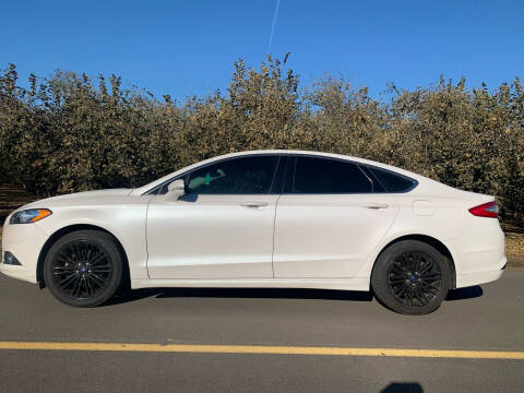 2014 Ford Fusion for sale at M AND S CAR SALES LLC in Independence OR