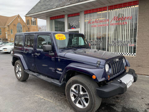 2013 Jeep Wrangler Unlimited for sale at KUHLMAN MOTORS in Maquoketa IA