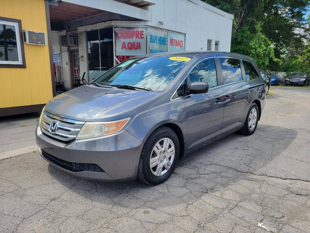 2012 Honda Odyssey for sale at DAGO'S AUTO SALES LLC in Dalton, GA