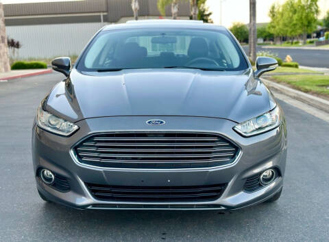 2014 Ford Fusion Hybrid for sale at MR AUTOS in Modesto CA