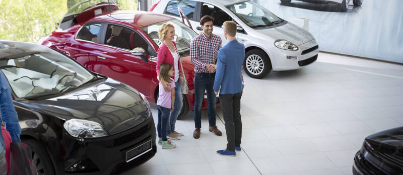 Family with car dealer customer service