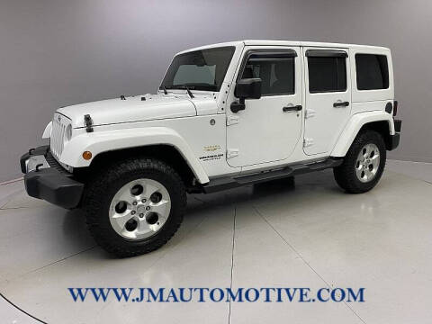 2015 Jeep Wrangler Unlimited for sale at J & M Automotive in Naugatuck CT
