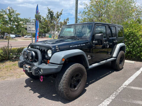 2012 Jeep Wrangler Unlimited for sale at Bay City Autosales in Tampa FL