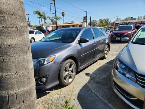 2014 Toyota Camry for sale at E and M Auto Sales in Bloomington CA