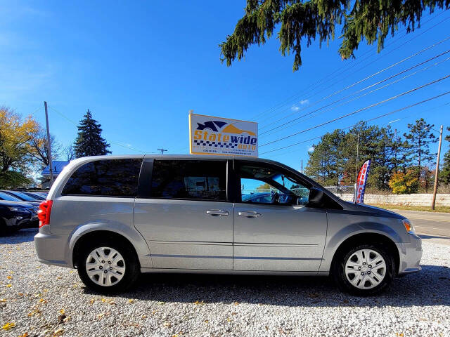 2014 Dodge Grand Caravan for sale at Statewide Auto LLC in Akron, OH