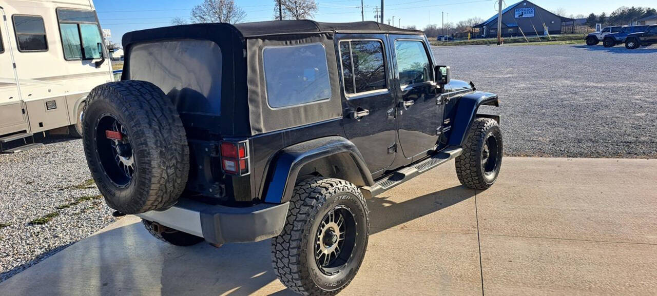 2013 Jeep Wrangler Unlimited for sale at CORNMAN AUTO LLC in Kirksville, MO