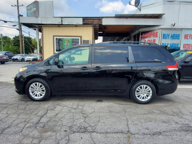 2013 Toyota Sienna for sale at DAGO'S AUTO SALES LLC in Dalton, GA