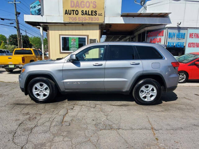 2014 Jeep Grand Cherokee for sale at DAGO'S AUTO SALES LLC in Dalton, GA