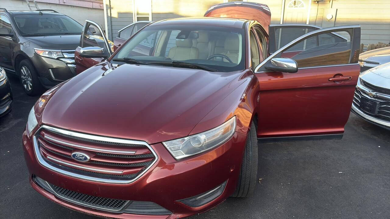 2014 Ford Taurus for sale at Ganda Auto Sales in Denver, CO