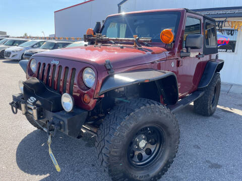 2009 Jeep Wrangler for sale at BELOW BOOK AUTO SALES in Idaho Falls ID