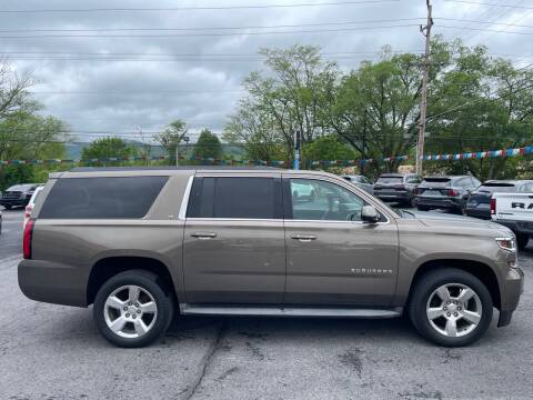 2015 Chevrolet Suburban for sale at MAGNUM MOTORS in Reedsville PA