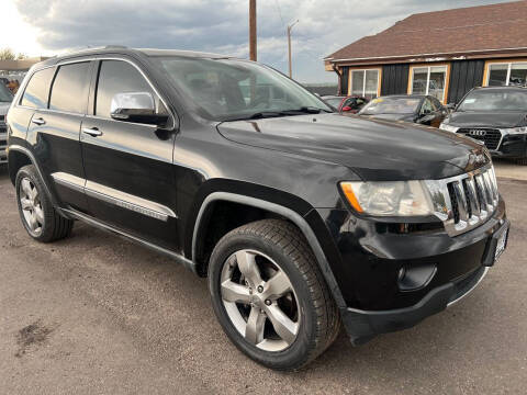 2011 Jeep Grand Cherokee for sale at BERKENKOTTER MOTORS in Brighton CO
