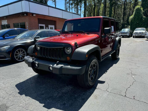 2012 Jeep Wrangler Unlimited for sale at Magic Motors Inc. in Snellville GA