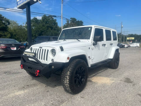 2013 Jeep Wrangler Unlimited for sale at Select Auto Group in Mobile AL