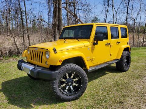 2015 Jeep Wrangler Unlimited for sale at COOP'S AFFORDABLE AUTOS LLC in Otsego MI