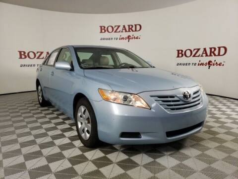 2009 Toyota Camry for sale at BOZARD FORD in Saint Augustine FL