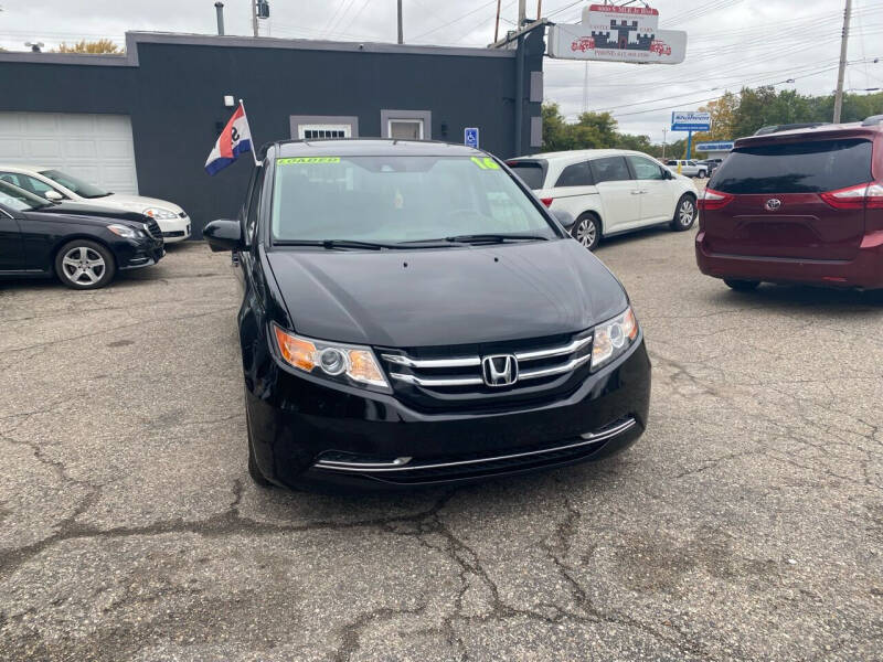 2016 Honda Odyssey for sale at Castle Cars Inc. in Lansing MI