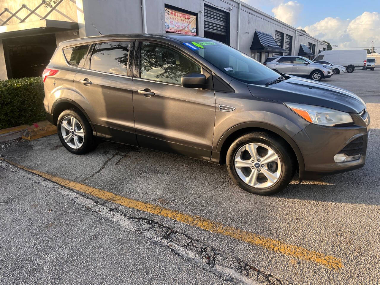 2014 Ford Escape for sale at M & J UNITED AUTO SALES in LAUDERDALE LAKES, FL