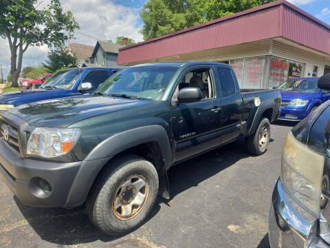 2011 Toyota Tacoma for sale at Maximum Auto Group II INC in Cortland OH