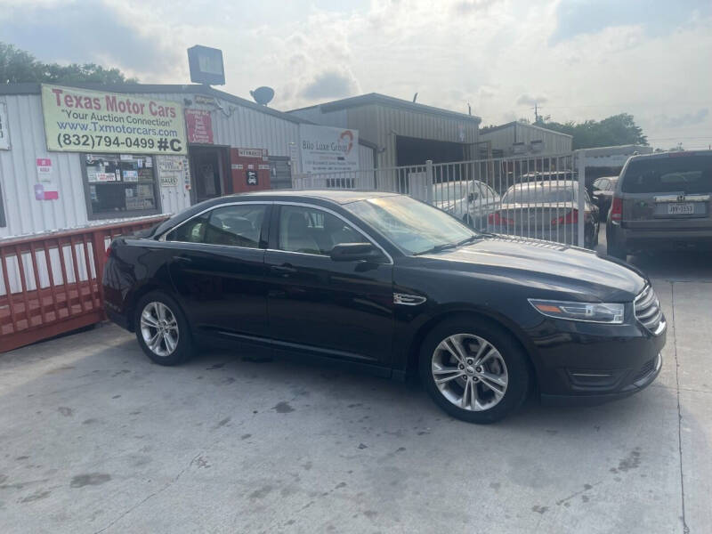 2014 Ford Taurus for sale at TEXAS MOTOR CARS in Houston TX