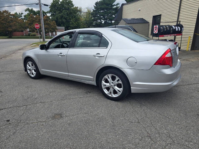 2012 Ford Fusion for sale at QUEENSGATE AUTO SALES in York, PA