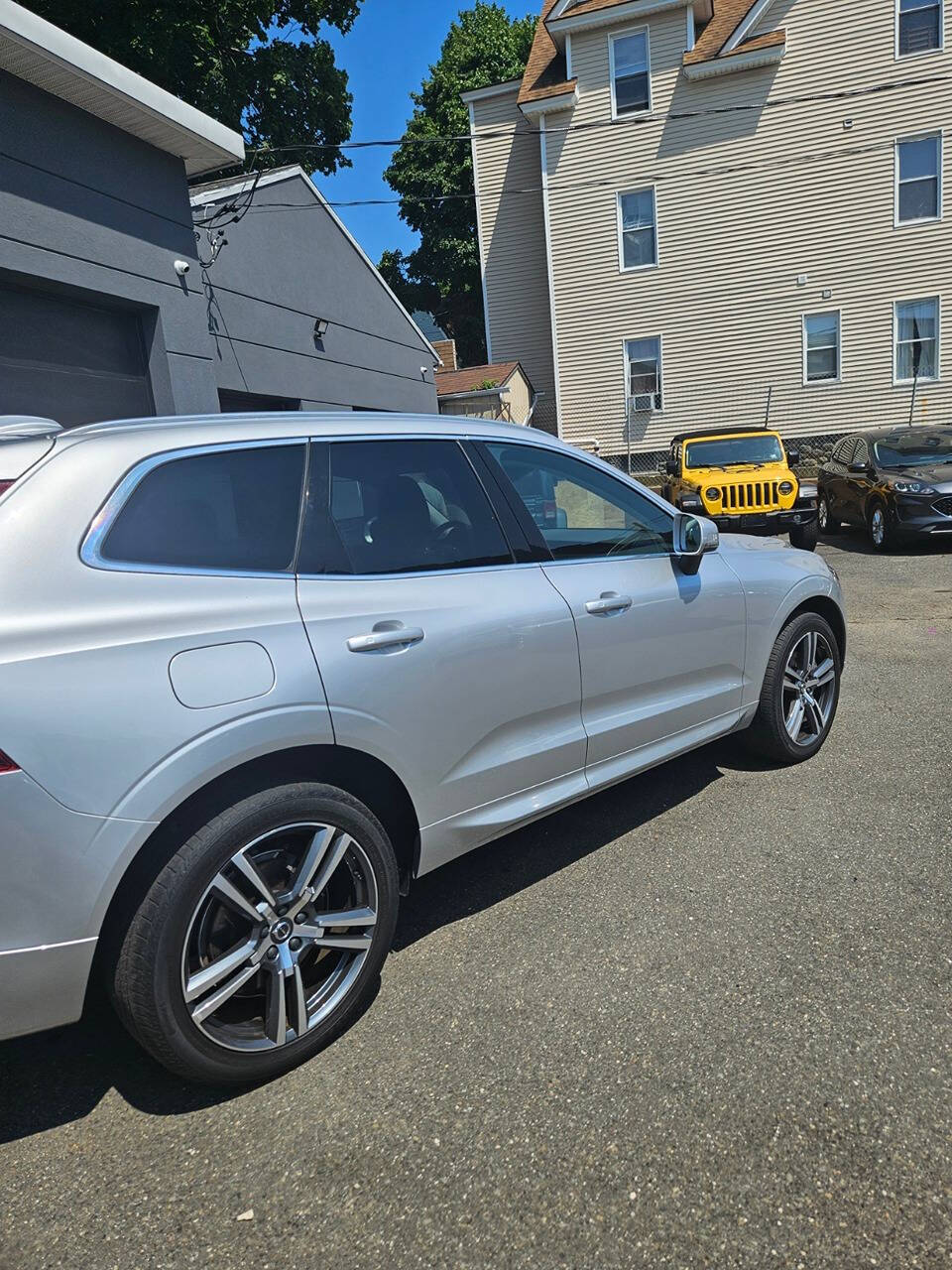 2021 Volvo XC60 for sale at RENOS AUTO SALES LLC in Waterbury, CT