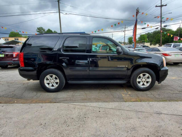 2008 GMC Yukon for sale at DAGO'S AUTO SALES LLC in Dalton, GA