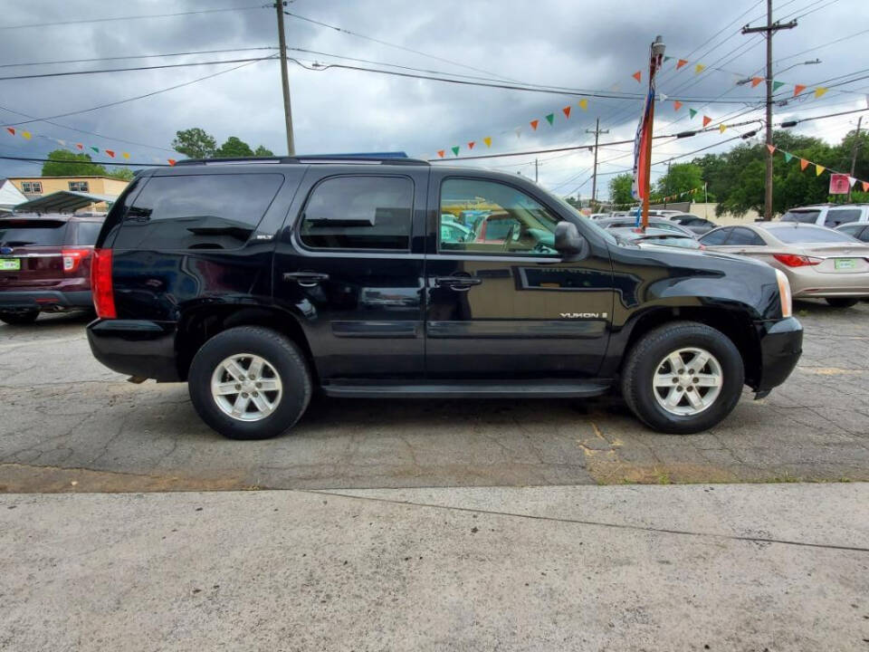 2008 GMC Yukon for sale at DAGO'S AUTO SALES LLC in Dalton, GA