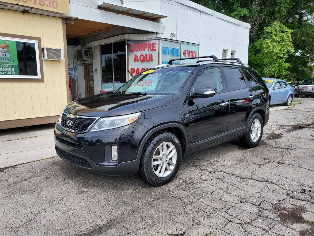 2014 Kia Sorento for sale at DAGO'S AUTO SALES LLC in Dalton, GA