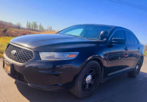 2014 Ford Taurus for sale at BELOW BOOK AUTO SALES in Idaho Falls ID
