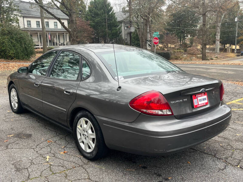 Used 2005 Ford Taurus SE with VIN 1FAFP53U35A248638 for sale in Roswell, GA