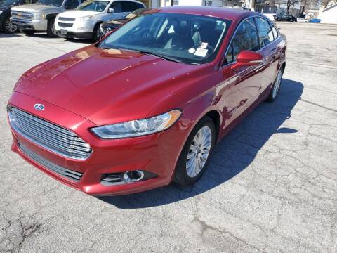 2014 Ford Fusion Hybrid for sale at D -N- J Auto Sales Inc. in Fort Wayne IN