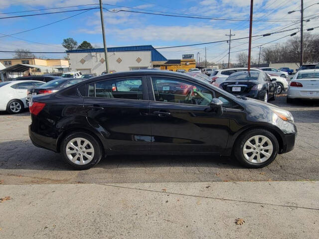 2015 Kia Rio for sale at DAGO'S AUTO SALES LLC in Dalton, GA