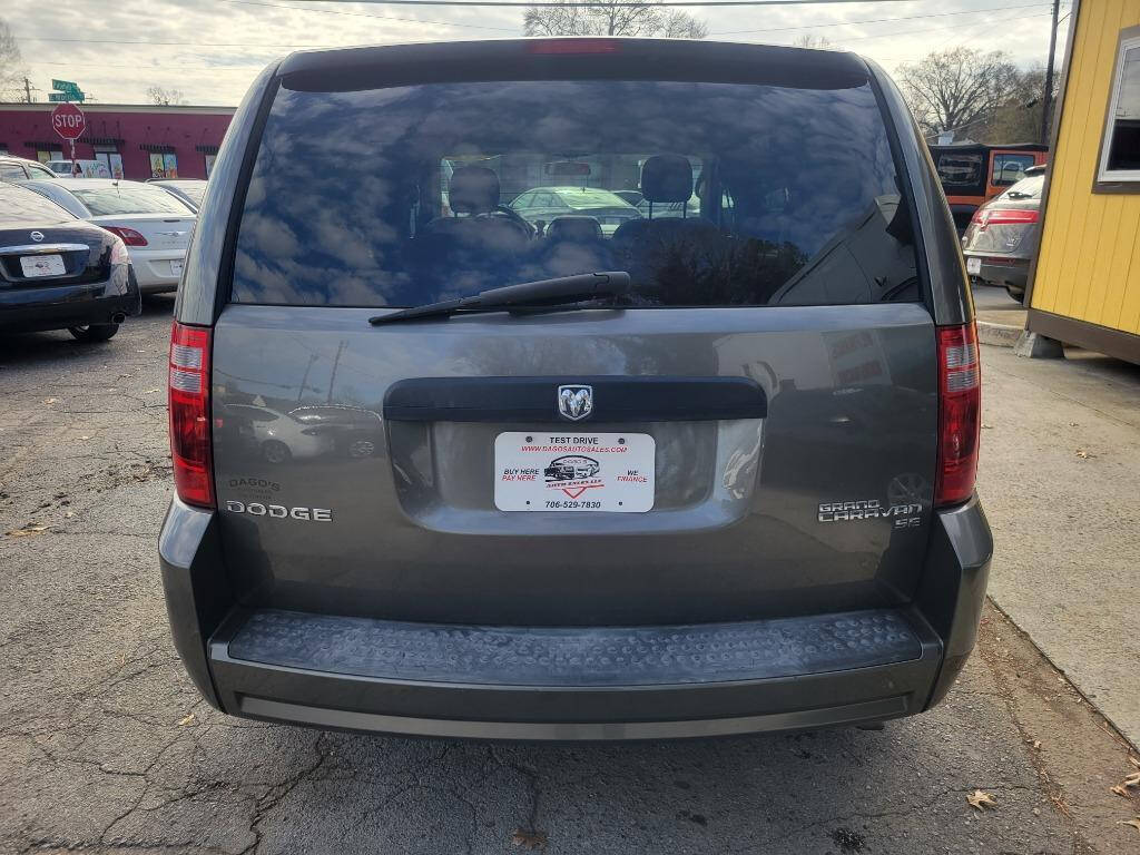 2010 Dodge Grand Caravan for sale at DAGO'S AUTO SALES LLC in Dalton, GA