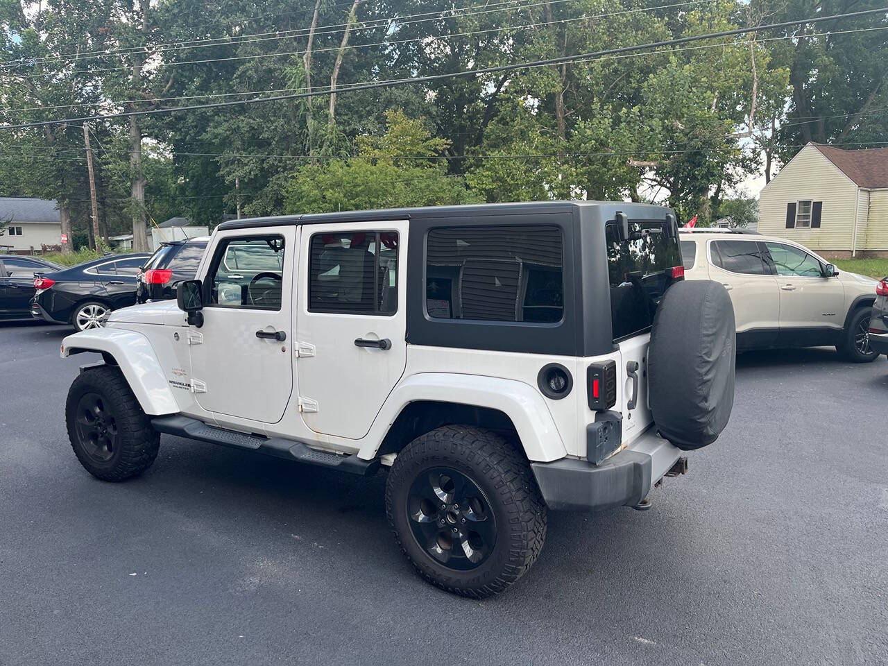 2013 Jeep Wrangler Unlimited for sale at Mitrione Motors in Springfield, IL