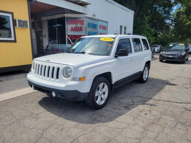 2014 Jeep Patriot for sale at DAGO'S AUTO SALES LLC in Dalton, GA