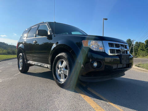 2011 Ford Escape for sale at Jim's Hometown Auto Sales LLC in Cambridge OH