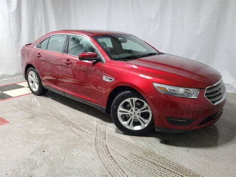 2014 Ford Taurus for sale at Tradewind Car Co in Muskegon MI