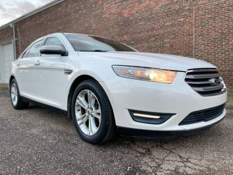 2014 Ford Taurus for sale at Jim's Hometown Auto Sales LLC in Byesville OH