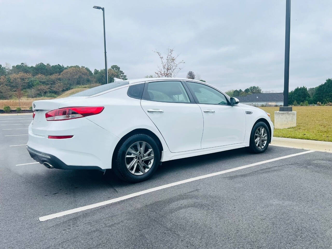 2019 Kia Optima for sale at Bluegate Motors LLC in Garner, NC