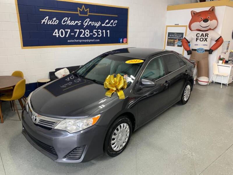 2012 Toyota Camry for sale at Auto Chars Group LLC in Orlando FL