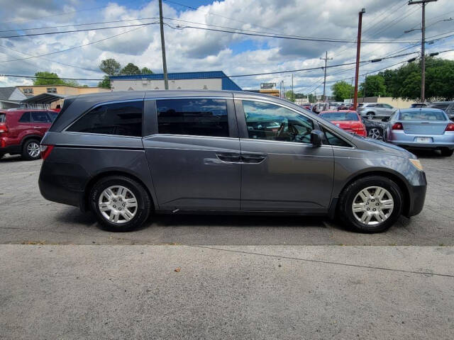 2012 Honda Odyssey for sale at DAGO'S AUTO SALES LLC in Dalton, GA