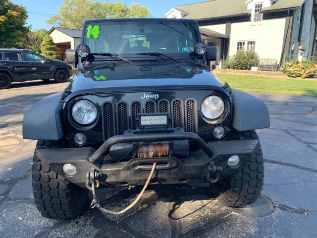 2014 Jeep Wrangler for sale at Chuckie Bizzarro's Fleetwing Auto in Erie, PA